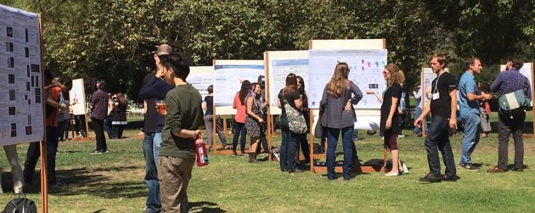 Outdoor poster presentations with people